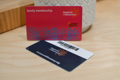 Two plastic giftcards showing barcode encryption on the backside