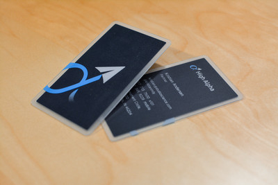 A closer look at the front and backside of a business card design featuring a paper airplane