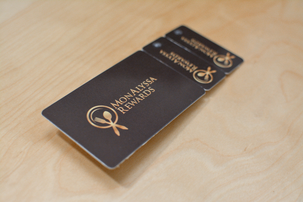 Two pink and purple card designs for a yoga studio card and key tag