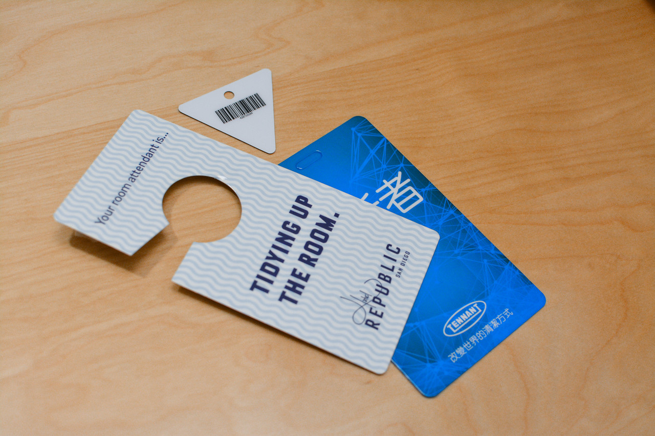 Two pink and purple card designs for a yoga studio card and key tag