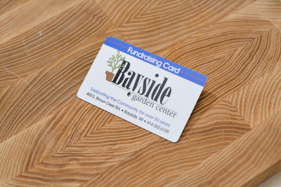 A greenhouse card design showing the logo and a plant