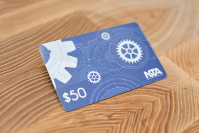 A blue card design with gears and blueprint graphics