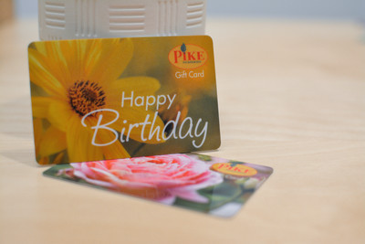 Two plant shop giftcards featuring photos of flowers and a happy birthday message