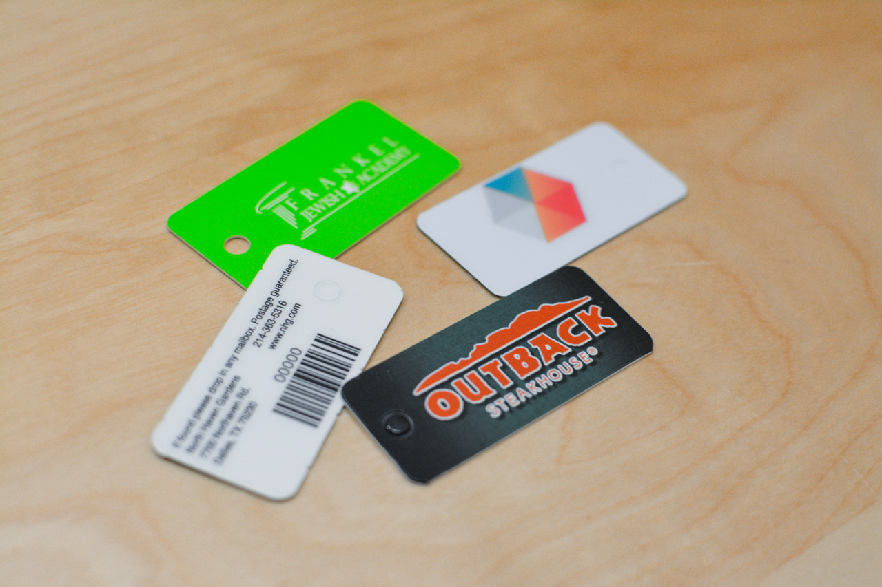 Two pink and purple card designs for a yoga studio card and key tag