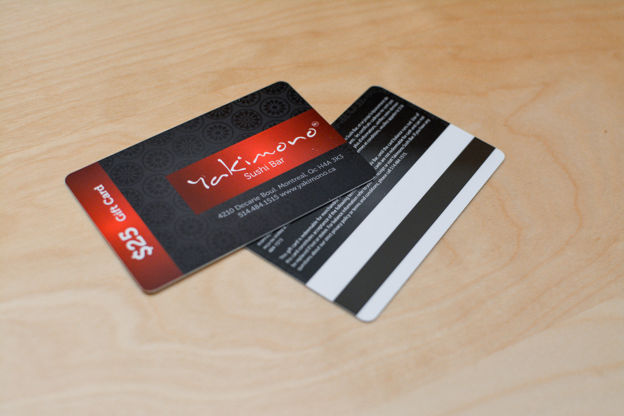 The front and back of a dark black card design used by a sushi restaurant