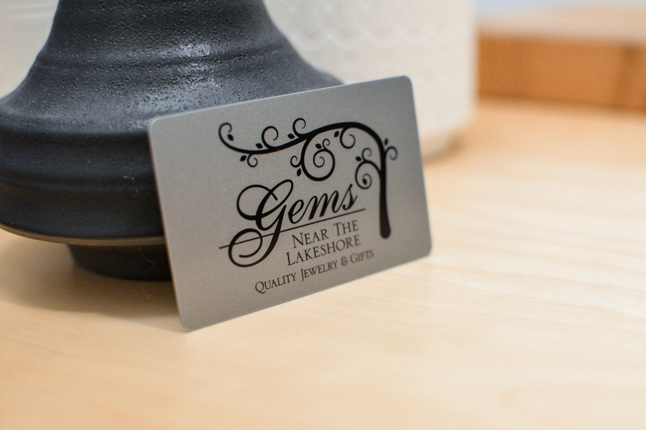 A shiney silver design used for a crystal and gem shop