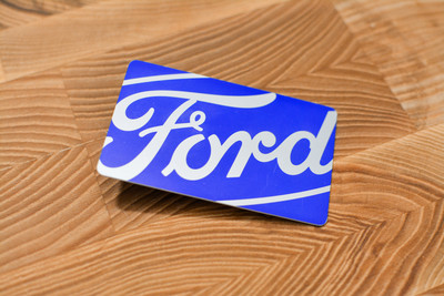 A very bright card design with a chrome finish and the Ford logo