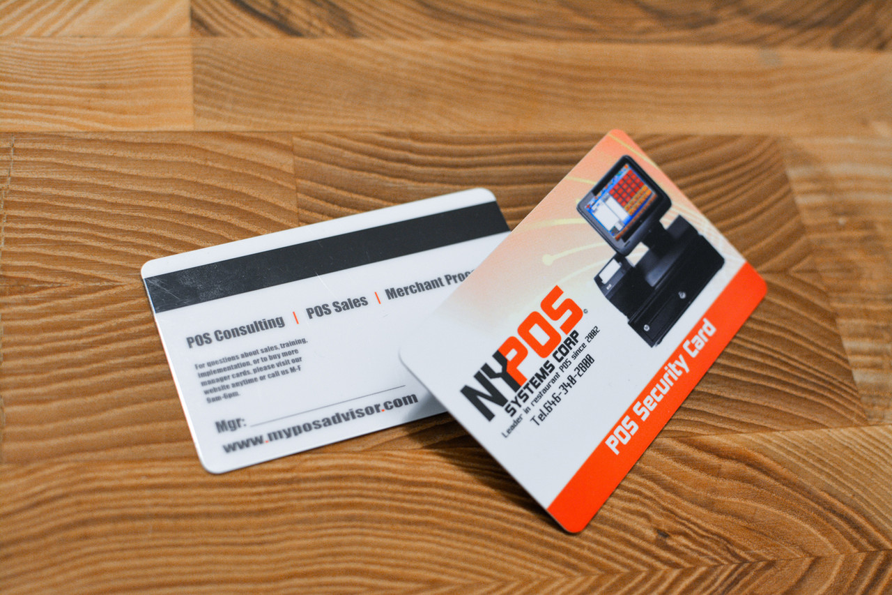 A card with several small logos used by a restaurant group showing a magnetic encoding stripe